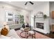 Bright living room featuring a fireplace, large window, and comfortable seating arrangement at 616 Angier Ne Ave # 4, Atlanta, GA 30308