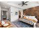 Cozy main bedroom with a wood accent wall and large windows at 616 Angier Ne Ave # 4, Atlanta, GA 30308