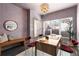 Bright home office featuring a modern desk, stylish decor, and a sunlit window creating an ideal workspace at 616 Angier Ne Ave # 4, Atlanta, GA 30308