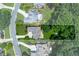 Aerial view of the property highlighting the home's layout, lot size, and surrounding trees for privacy at 650 Chestatee Creek Nw Dr, Acworth, GA 30101
