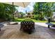 Inviting backyard patio with stone pavers, a fire pit, and outdoor seating, perfect for entertaining at 650 Chestatee Creek Nw Dr, Acworth, GA 30101