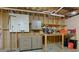 Unfinished basement area with exposed ceiling, shelving, storage, and lighting at 650 Chestatee Creek Nw Dr, Acworth, GA 30101