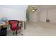 Spacious bedroom featuring neutral walls, plush carpeting, ceiling fan, and a comfortable workspace area at 650 Chestatee Creek Nw Dr, Acworth, GA 30101