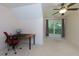 Bright bedroom with a window view, neutral walls, plush carpeting, and a comfortable workspace area at 650 Chestatee Creek Nw Dr, Acworth, GA 30101