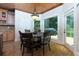 Charming breakfast nook with hardwood floors, wood ceiling, and views to the backyard deck at 650 Chestatee Creek Nw Dr, Acworth, GA 30101