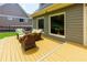 Outdoor deck with wooden railing and patio furniture at 650 Chestatee Creek Nw Dr, Acworth, GA 30101
