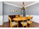 Cozy dining room featuring hardwood floors, a classic chandelier, and neutral paint colors at 650 Chestatee Creek Nw Dr, Acworth, GA 30101