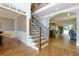 Foyer with hardwood flooring, staircase, and open views of the living spaces at 650 Chestatee Creek Nw Dr, Acworth, GA 30101