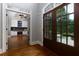Foyer with wood floors, doorway to the study and entrance at 650 Chestatee Creek Nw Dr, Acworth, GA 30101