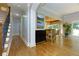 Open foyer with hardwood floors leading to the living spaces and staircase at 650 Chestatee Creek Nw Dr, Acworth, GA 30101