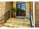Elegant double front door with stone steps and a decorative plant at 650 Chestatee Creek Nw Dr, Acworth, GA 30101