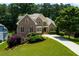 Beautiful two-story brick home with manicured lawn and mature trees in a desirable neighborhood at 650 Chestatee Creek Nw Dr, Acworth, GA 30101