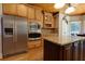 Gourmet kitchen with stainless steel appliances, granite countertops, custom wood cabinets and a large kitchen island at 650 Chestatee Creek Nw Dr, Acworth, GA 30101
