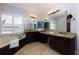 Bright bathroom with dual sinks, granite countertops, soaking tub and natural light at 650 Chestatee Creek Nw Dr, Acworth, GA 30101