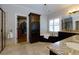 Well-appointed bathroom with granite counters, soaking tub, and walk-in closet access at 650 Chestatee Creek Nw Dr, Acworth, GA 30101