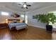 Spacious main bedroom with tray ceilings, hardwood floors, and large windows at 650 Chestatee Creek Nw Dr, Acworth, GA 30101