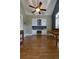 Spacious office with hardwood flooring, built-in cabinets, and modern ceiling fan at 650 Chestatee Creek Nw Dr, Acworth, GA 30101
