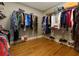 Spacious walk-in closet with hardwood floors and custom shelving for optimal storage at 650 Chestatee Creek Nw Dr, Acworth, GA 30101