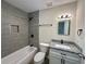 Remodeled bathroom with modern vanity, stylish fixtures, and tiled shower at 1343 Old Coach Sw Rd, Marietta, GA 30008