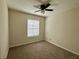 Cozy bedroom featuring plush carpeting, a ceiling fan, and lots of light at 1343 Old Coach Sw Rd, Marietta, GA 30008