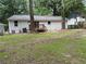 Lawn view to the house and stained deck at 2943 Westbury Dr, Decatur, GA 30033