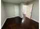 Bedroom featuring hardwood floors, neutral paint, and doorways to other rooms at 2943 Westbury Dr, Decatur, GA 30033