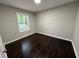Bedroom features hardwood floors, natural light from a window, and neutral paint at 2943 Westbury Dr, Decatur, GA 30033
