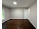 Bedroom features hardwood floors, natural light from a window, and neutral paint at 2943 Westbury Dr, Decatur, GA 30033