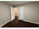 Bedroom featuring hardwood floors, neutral paint, and doorways to other rooms at 2943 Westbury Dr, Decatur, GA 30033