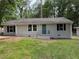 Charming single-story home with freshly painted exterior and well-maintained front lawn at 2943 Westbury Dr, Decatur, GA 30033