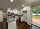 Modern kitchen featuring white cabinets, granite countertops, stainless steel appliances and backyard access at 2943 Westbury Dr, Decatur, GA 30033