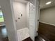 Convenient laundry closet with hookups and a louvered door located adjacent to a room with hardwood floors at 2943 Westbury Dr, Decatur, GA 30033