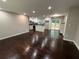 Spacious living room with hardwood floors flowing into an updated kitchen and dining area at 2943 Westbury Dr, Decatur, GA 30033