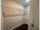 Walk-in closet with dark floors, white walls, and wire shelving for storage and organization at 2943 Westbury Dr, Decatur, GA 30033