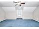 Large bedroom featuring blue carpet, ceiling fan and natural light at 2983 Trotters View Way, Snellville, GA 30039