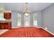 Cozy dining area with chandelier, windows, and view into the kitchen at 2983 Trotters View Way, Snellville, GA 30039