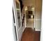 Inviting entryway with hardwood floors and staircase leading to the upper level with kitchen access at 2983 Trotters View Way, Snellville, GA 30039