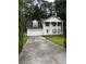 Charming two-story home with classic curb appeal, white garage door and pillar-supported porch at 2983 Trotters View Way, Snellville, GA 30039