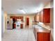 Large kitchen with stainless steel appliances, tile backsplash, and ample cabinetry at 2983 Trotters View Way, Snellville, GA 30039