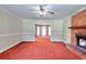 Spacious living room with brick fireplace and an open view to a dining space at 2983 Trotters View Way, Snellville, GA 30039