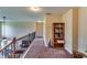Hallway with hardwood floors, bookshelf, and wrought iron banister at 609 Turnbill Dr, Mcdonough, GA 30252