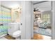 Bright bathroom adjacent to the living room, featuring a vanity and shower at 778 Mclendon Dr, Decatur, GA 30079