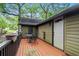 Outdoor deck with a table and chairs, leading to the backdoor at 778 Mclendon Dr, Decatur, GA 30079