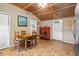 Kitchen featuring a wooden dining table, a red cabinet, and a door to the outside at 778 Mclendon Dr, Decatur, GA 30079