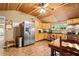 Spacious kitchen with stainless steel appliances, wooden cabinets, and a dining area at 778 Mclendon Dr, Decatur, GA 30079