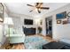 Bright living room featuring hardwood floors, a ceiling fan, and modern decor at 778 Mclendon Dr, Decatur, GA 30079