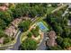 Aerial view of tennis court, community landscaping, and multi-Gathering housing at 104 Powell Cv, Decatur, GA 30030