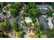 Aerial view of community swimming pool and surrounding amenities, nestled among lush landscaping and residences at 104 Powell Cv, Decatur, GA 30030