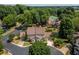 Aerial view showcasing a home with lush landscaping, well-maintained lawn, and surrounding greenery in a peaceful neighborhood at 104 Powell Cv, Decatur, GA 30030