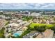 Aerial view highlighting the community pool and local cityscape amenities at 104 Powell Cv, Decatur, GA 30030